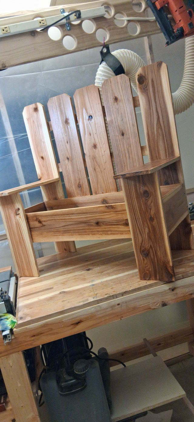 Cedar Adirondack bench planter in workshop - front view